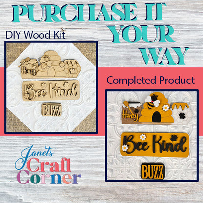 An image showcasing a Bee Interchangeable Insert kit by Janet's Craft Corner, featuring a DIY wood kit and its completed product. This kit, ideal for interchangeable home decor, includes wooden cutouts with the words "Honey," "Bee Kind," and "Buzz." The finished piece displays painted honeycombs and bees alongside these phrases.