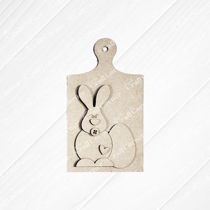 The Easter Decor Set from Janet's Craft Corner is a DIY seasonal home decor kit with five choices, featuring wooden pieces like a bunny with heart paw and button details—ideal for your handcrafted Easter decorations or projects.