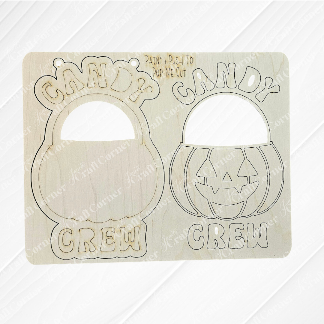 The Janet's Craft Corner Candy Crew Kids Pop-Out includes two wooden cutouts with engraved jack-o’-lantern buckets and “CANDY CREW”—one solid, one with pop-out shapes. Ideal for festive holiday décor or as a fun DIY craft kit for kids.
