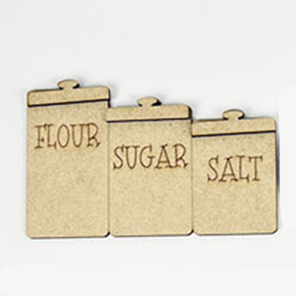 A delightful Baking - Tiered Tray Kit from Janet's Craft Corner features three wooden containers labeled in capital letters: "FLOUR," "SUGAR," and "SALT." These containers, each complete with a lid, are arranged on the tiered tray, bringing a touch of classic farmhouse decor to any space.