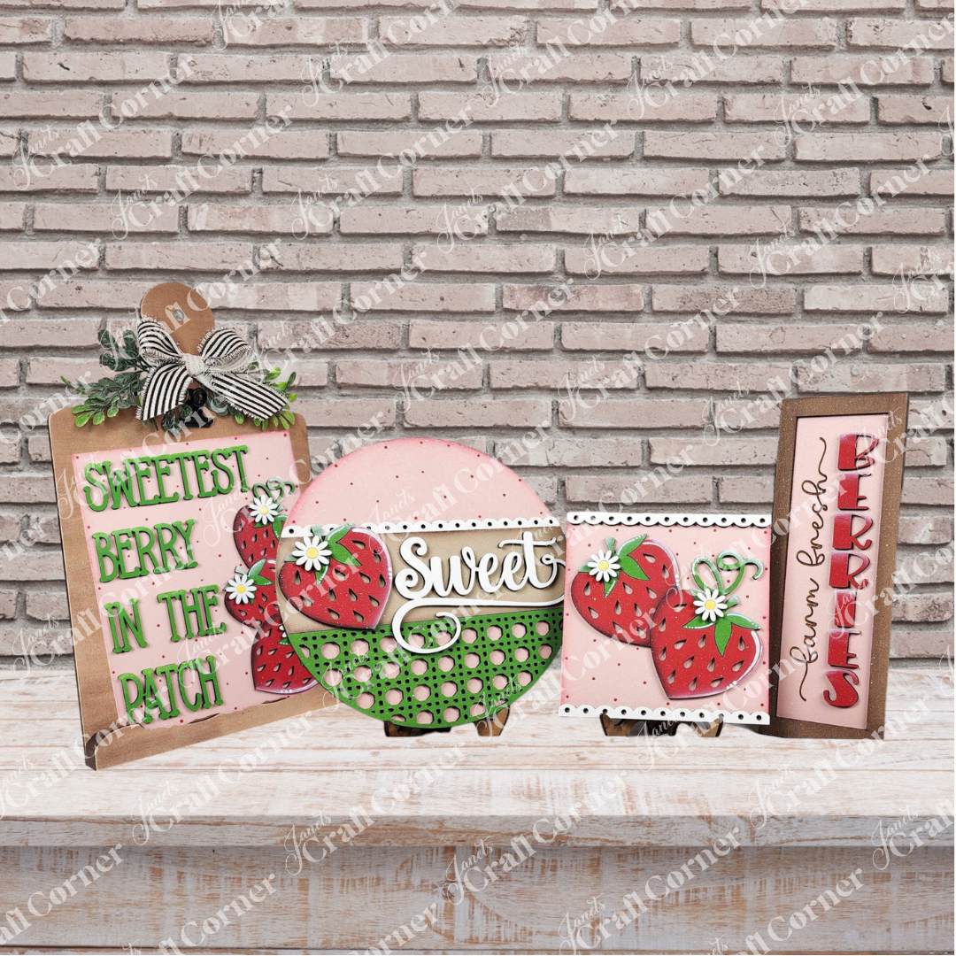 Four strawberry-themed signs with red berries, green leaves, and sweet sayings are featured—perfect inspiration for your next Janet's Craft Corner "Crafted by You!" DIY home decor craft kit monthly subscription.