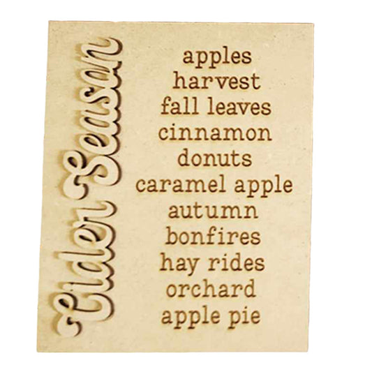 The image beautifully showcases Janet's Craft Corner's "Cider Words Interchangeable Sign" DIY home decor craft kit. The wooden sign, engraved with "Cider Season," is complemented on the right by lively words that evoke apples, harvest, and fall leaves. Together, they conjure the cozy essence of autumn with cinnamon donuts, caramel apple treats, bonfires, hay rides at the orchard, and apple pie delights.