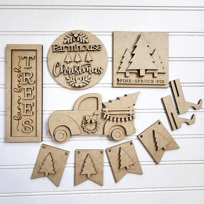 The Farmhouse Christmas Tiered Tray DIY Decor Kit - Set of 5 pieces, from Janet's Craft Corner, is a charming collection of wooden decorations on a white background. Ideal for a mistletoe tiered tray or as part of a DIY craft project, it includes signs featuring "Farmhouse Christmas," vintage trucks, trees, wreaths, and festive banners with tree cutouts for delightful home décor.