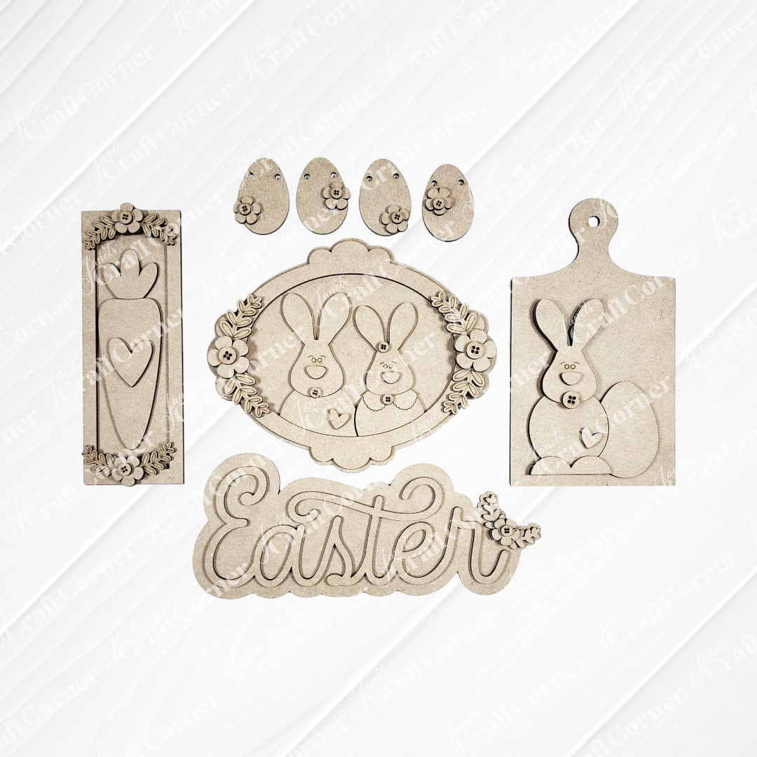 Janet's Craft Corner Easter Decor Set features laser-cut wooden shapes—bunnies, eggs, carrot, flowers, and "Easter" in cursive. Ideal DIY craft kit for creating personalized seasonal home decor. Choice of 5 designs included.