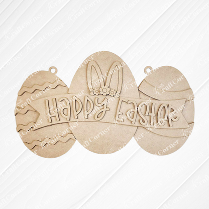 The Easter Egg Sign from Janet's Craft Corner is a charming DIY seasonal home decor craft kit featuring three eggs on a striped background. The centerpiece has bunny ears and a floral headband with "Happy Easter" beautifully written, perfect for adding festive charm to your home.