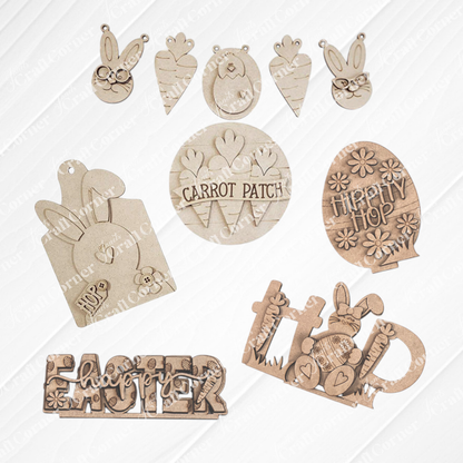 Janet's Craft Corner presents the Easter Trio Mini Shelf Sitters DIY kit, a set of 3 wooden pieces: "Happy Easter" sign, an egg shape with "Hippity Hop," and a "Hop" sign with bunny and carrots, all hand-painted with floral designs to elevate your Easter decor.