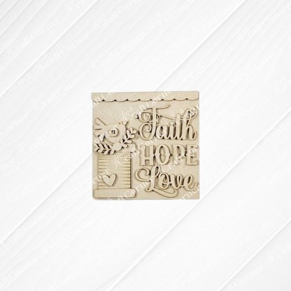 The Heirloom Decor Set from Janet's Craft Corner includes a wooden plaque with a bird, leaves, heart, and “Faith Hope Love” elegantly carved—a charming DIY craft kit for seasonal home decor.