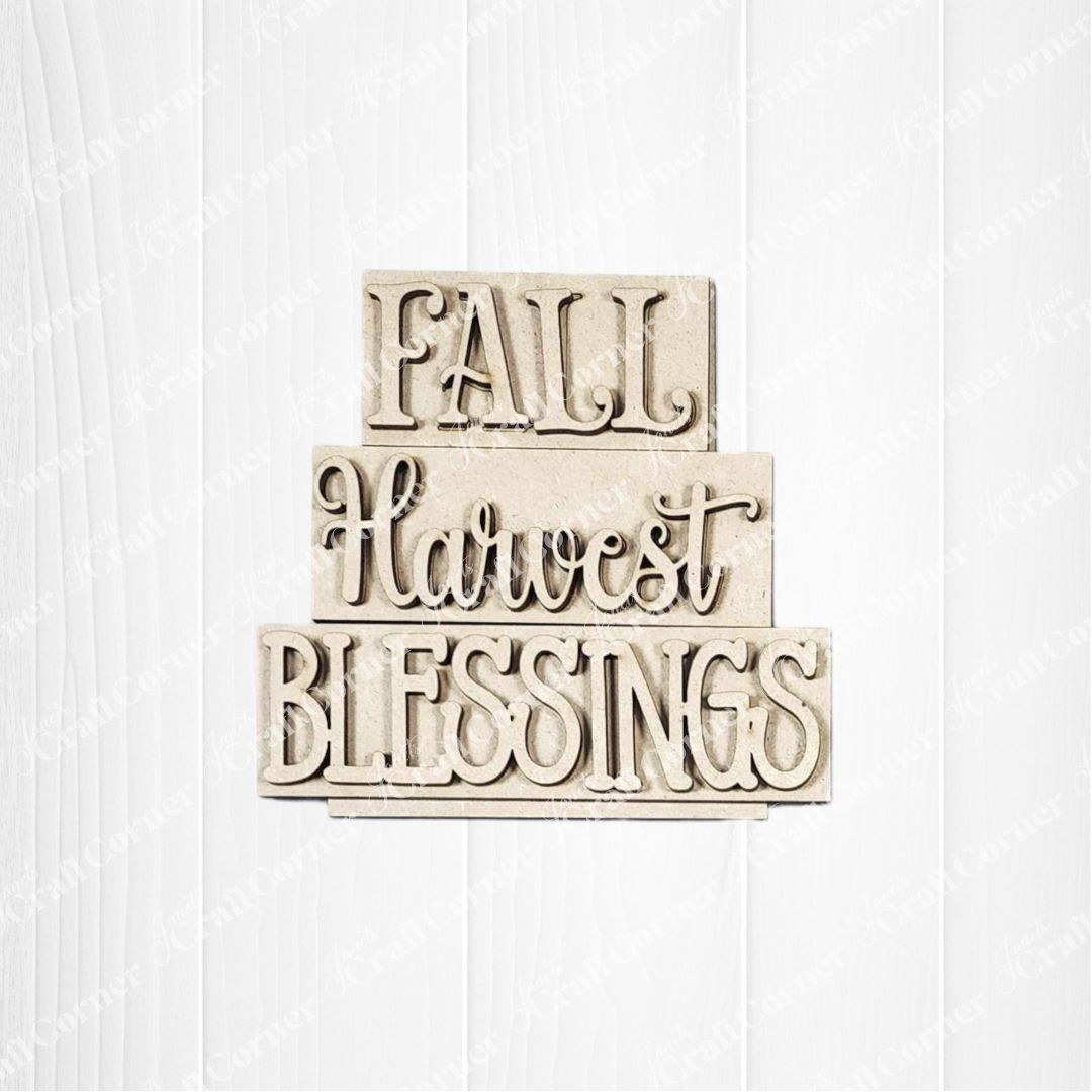 Janet’s Craft Corner Fall Harvest Mini Shelf Sitters is a DIY seasonal home decor kit featuring a textured wooden sign with "FALL," "Harvest," and "BLESSINGS"—perfect for autumn displays. Set of 1.
