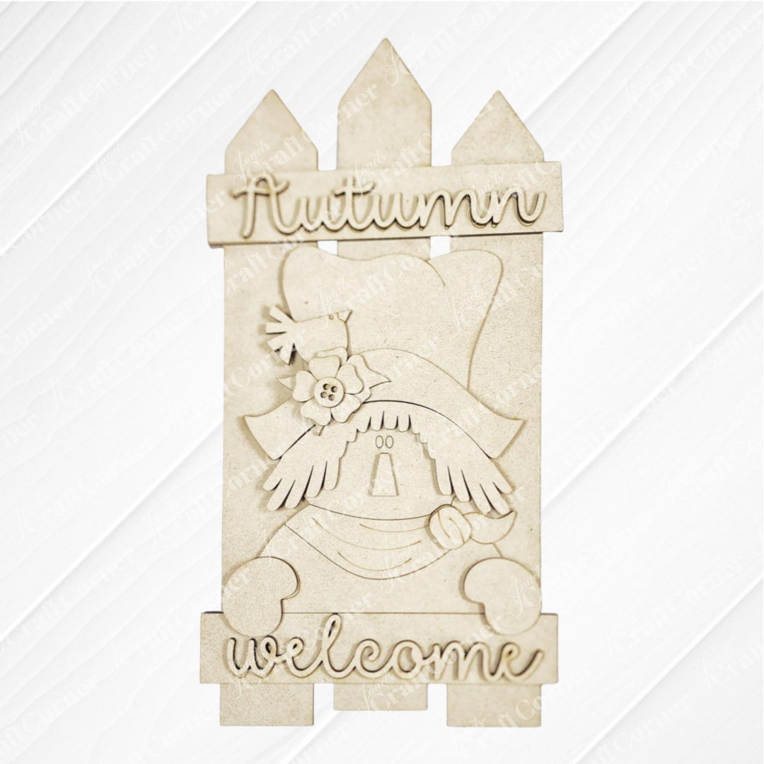 Janet's Craft Corner Fall Scarecrow Fence Leaner: a DIY seasonal decor kit with a beige picket fence shape, scarecrow with hat and flower, and “Autumn welcome” text—perfect for outdoor fall display. Set of 1.