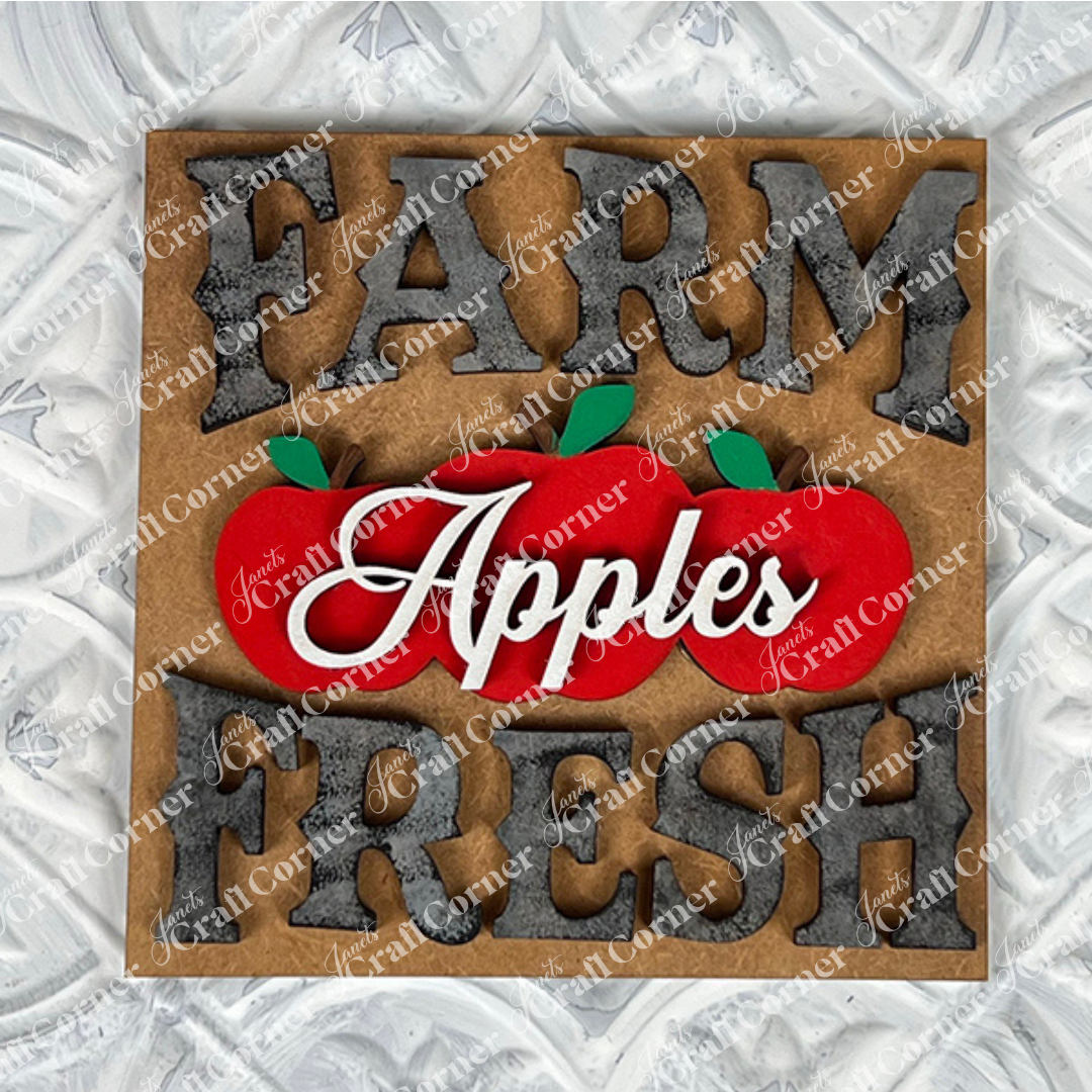Janet's Craft Corner Farm Fresh Apples Square: A rustic sign reading "FARM FRESH" with "Apples" in cursive above three red apples and green leaves, perfect as a charming DIY seasonal home decor accent for small spaces.