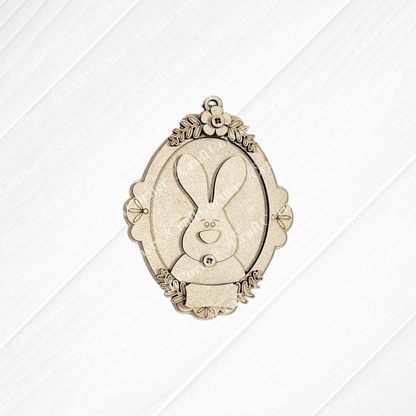 Janet's Craft Corner Framed Easter Bunny Basket Tags: Oval wooden ornaments with a simple bunny face and leaf accents, perfect for personalized Easter décor or as basket tags.