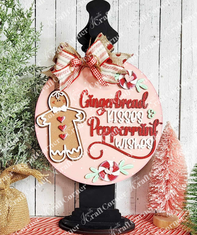 Gingerbread Kisses & Peppermint Wishes Door Hanger painted sample hanging on sign holder by Janet's Craft Corner