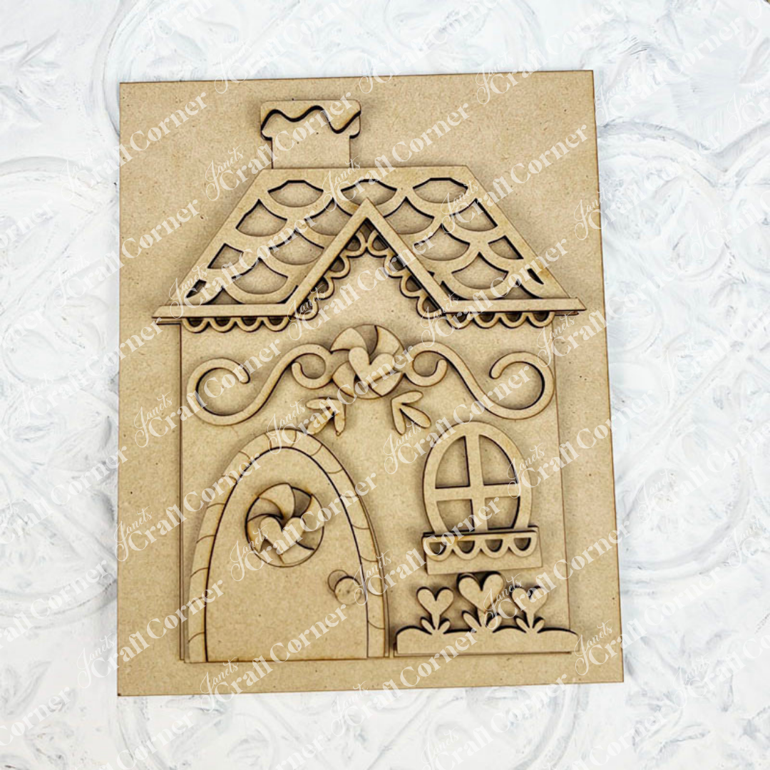 Janet's Craft Corner Gingerbread House Farmhouse Sign DIY kit: laser-cut wooden panel featuring a cute gingerbread house with icing decorations—ideal for making your own seasonal home decor.