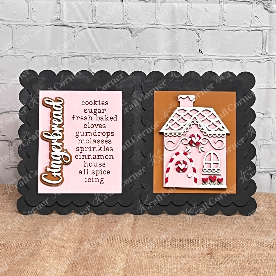 Janet's Craft Corner Double Scallop Trim Switchable Farmhouse Signs Frame—set of 1—displays a pink gingerbread ingredient card and a pink & white gingerbread house. Perfect for DIY seasonal home decor or as an interchangeable craft sign.