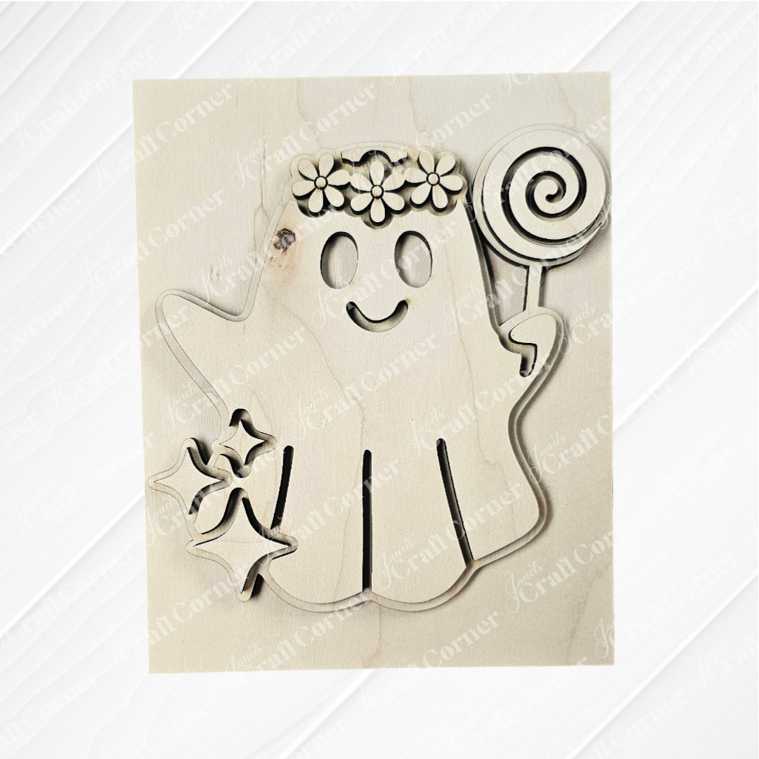 Add a touch of whimsy to your decor with Janet's Craft Corner Halloween Farmhouse Signs—a wooden ghost cutout with a lollipop, flower crown, and stars—perfect for DIY seasonal displays or tiered trays.