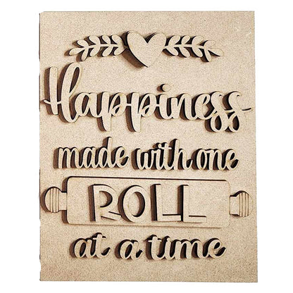 Introducing the "Happiness Kitchen Interchangeable Sign" DIY home decor craft kit by Janet's Craft Corner. This charming wooden plaque features carved text that reads "Happiness made with one roll at a time," along with decorative rolling pin and heart accents—perfect for enhancing your home with a personal touch.