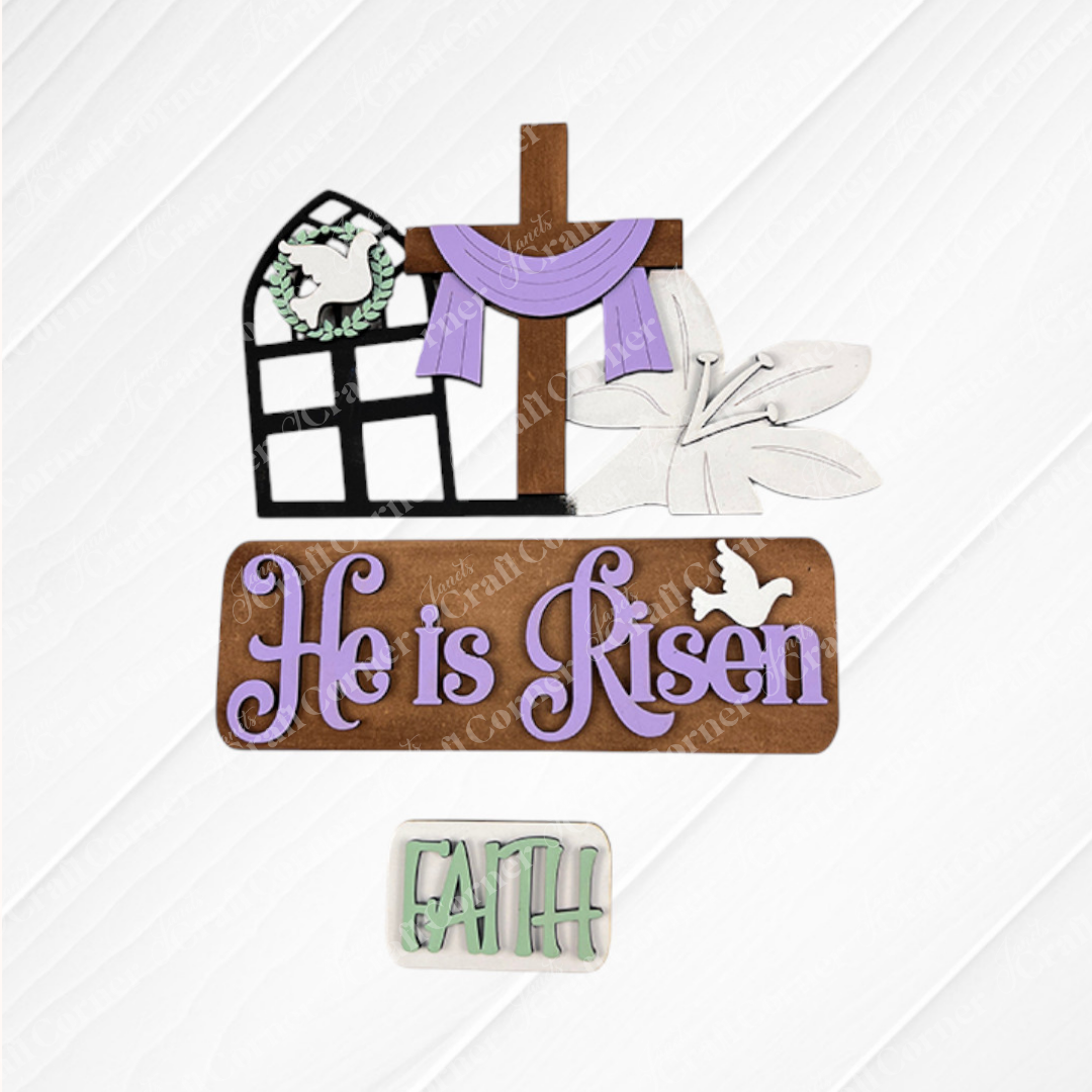 This Easter-themed decoration, from Janet's Craft Corner, showcases a cross adorned with a purple cloth, a dove, and lilies. It features "He is Risen" in purple and "FAITH" in green on a wooden backdrop. Ideal for home decor, the He is Risen Interchangeable Insert - Painted offers versatile seasonal updates with its interchangeable inserts.