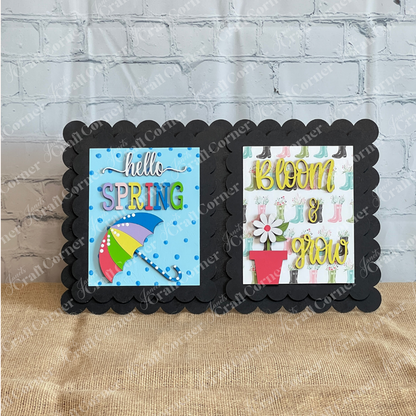 Add spring flair to your tiered tray with Janet’s Craft Corner Spring Switchable Farmhouse Signs DIY Kit—includes two colorful cards: “hello SPRING” with umbrella and “BLOOM & grow” with flowerpot and boots, on a black scalloped frame.