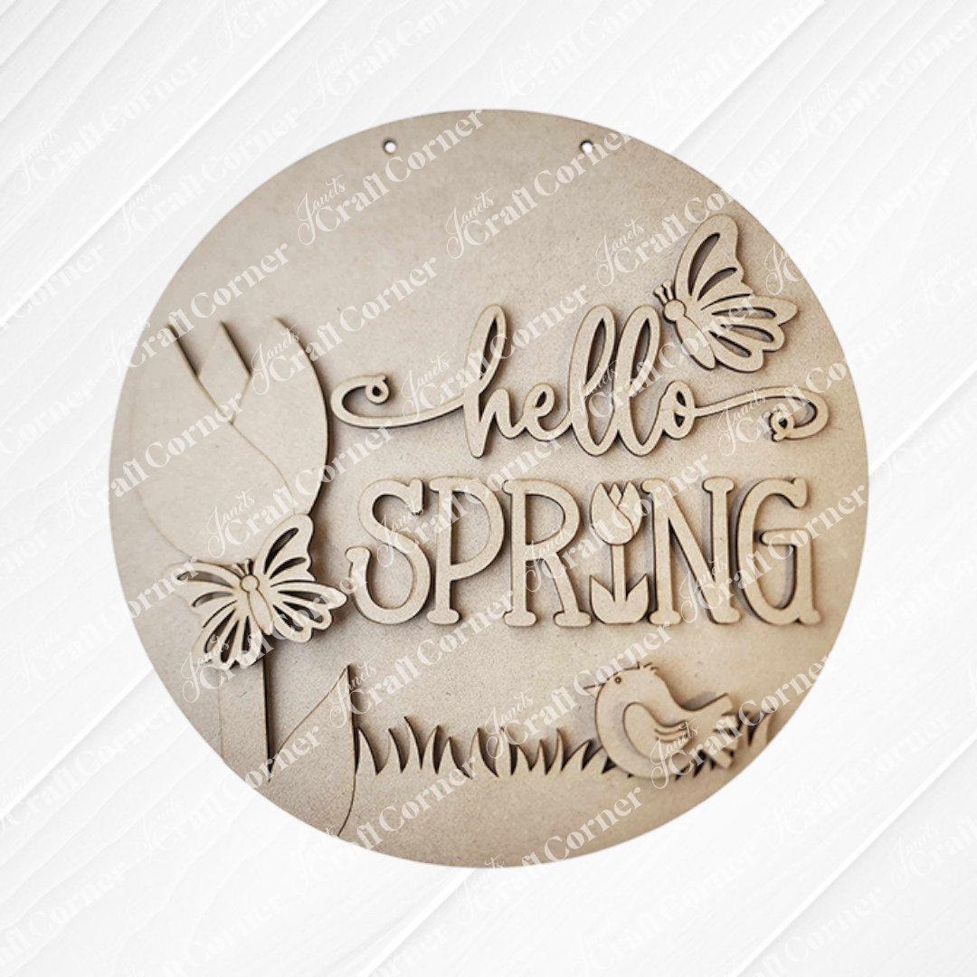 Create your own seasonal charm with Janet's Craft Corner's "Hello Spring Round Door Hanger" DIY kit, featuring decorative "hello spring" on white paneling and cut-out butterfly, flower, bird, and grass shapes—perfect for your spring decor.