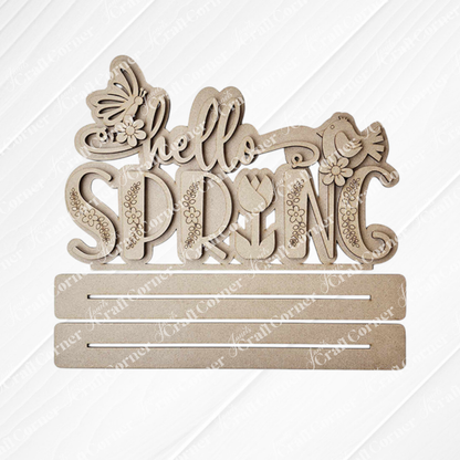 Janet's Craft Corner presents the "Hello Spring" Word Art Standing Shelf Sitter, a DIY wooden cutout featuring decorative script with butterfly, bird, and flower accents. Customize your home décor piece with additional elements using two slots provided.