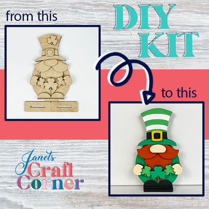 A two-panel image illustrates a Leprechan Gnome Shelf Sitter transformation from Janet's Craft Corner. Left panel: an unfinished wooden cutout from the DIY Kit. Right panel: a painted leprechaun with a green hat and shamrocks, ideal for home décor. Text displays "from this" and "to this.