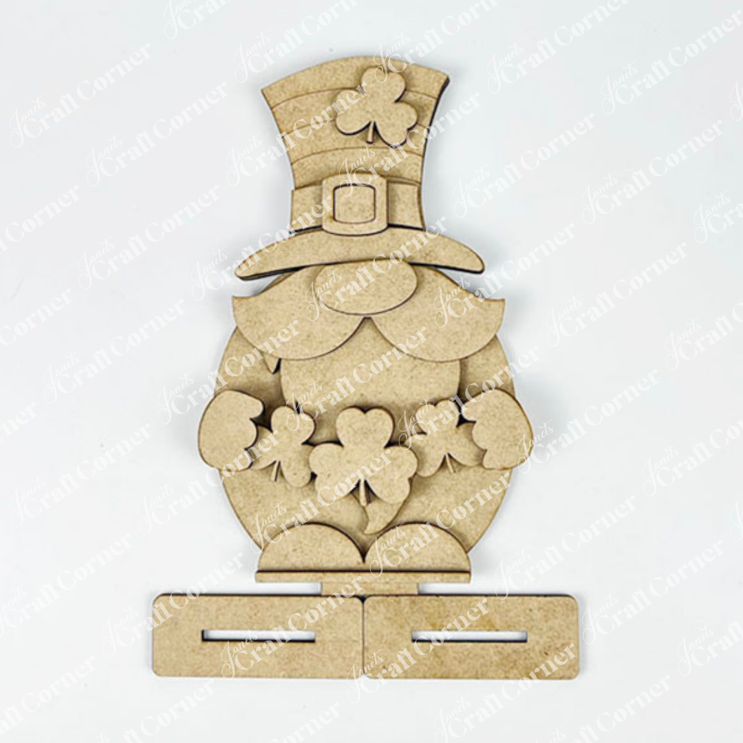 Discover the Leprechan Gnome Shelf Sitter DIY Kit from Janet's Craft Corner—a wooden cutout for seasonal home décor. It features a shamrock hat and charm cluster with slots for easy assembly, perfect for your next craft project!.