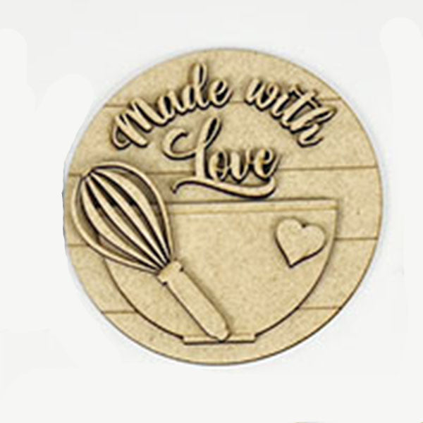 Introducing the Baking - Tiered Tray Kit by Janet's Craft Corner: a round wooden plaque featuring a carved mixing bowl and whisk, accompanied by the text "Made with Love" above a heart. The plaque's horizontal grooves make it an ideal addition for charming farmhouse decor.