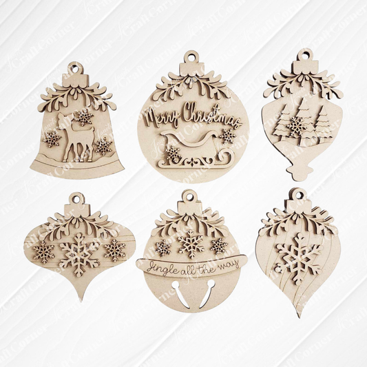 The Mistletoe Ornaments DIY Decor Kit by Janet's Craft Corner features six festive wooden ornaments—reindeer, sleigh, trees, snowflakes, and “Jingle all the way”—perfect for charming holiday decor or crafting fun.