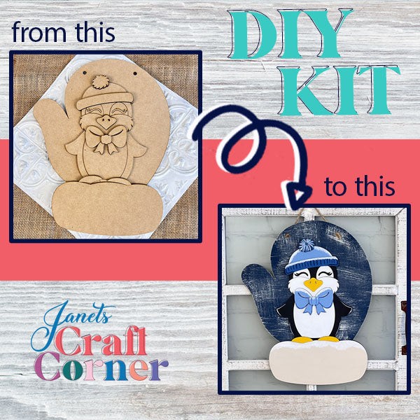 An image displays a DIY craft kit featuring an unpainted wooden cutout of the Penguin Mitten Sign dressed in winter attire on the left, and a stunningly painted version on the right. The text reads "from this" to "DIY Kit" and "to this," adorned with Janet's Craft Corner logo, making it perfect for your home décor projects!