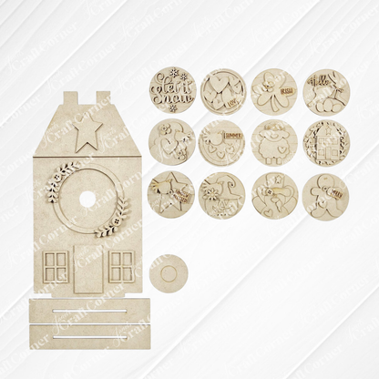 Janet's Craft Corner Saltbox House Round Display is a DIY seasonal home decor craft kit featuring a wooden saltbox house shape with windows, a wreath, and 12 engraved round discs for year-round creative decorating. Set of 1.