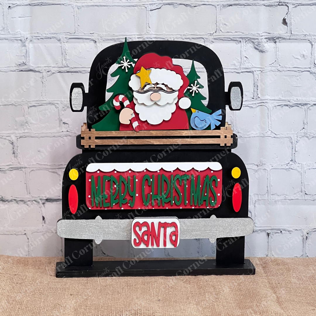 The Santa Merry Christmas Interchangeable Insert from Janet's Craft Corner is a 3-piece DIY seasonal home decor kit featuring Santa in a truck with festive accents—perfect for decorating your Christmas space.