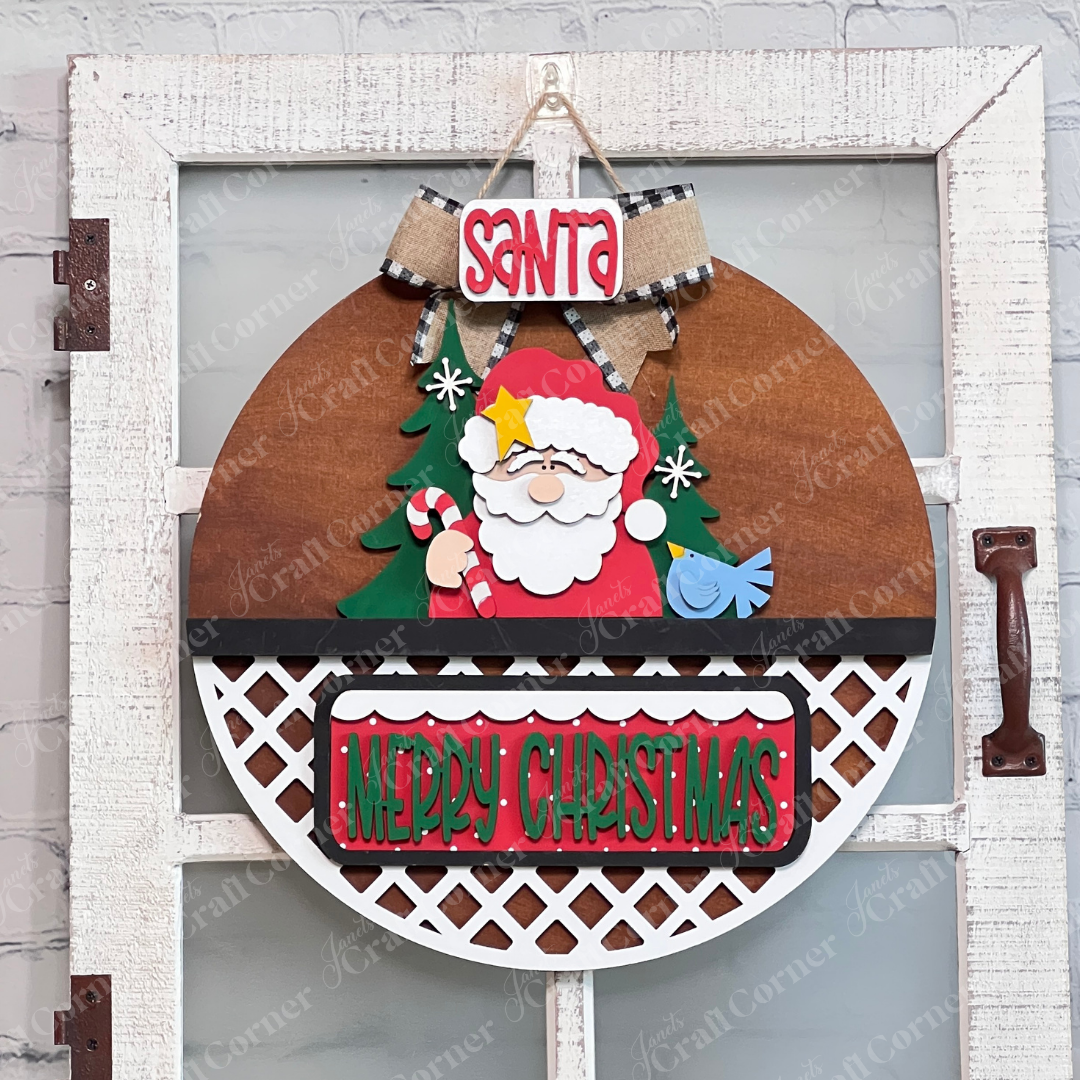 Brighten your entryway with Janet's Craft Corner's Santa Merry Christmas Interchangeable Insert, a 3-piece DIY seasonal home decor kit featuring a cheerful Santa, green tree, blue bird, and festive “Merry Christmas” message.