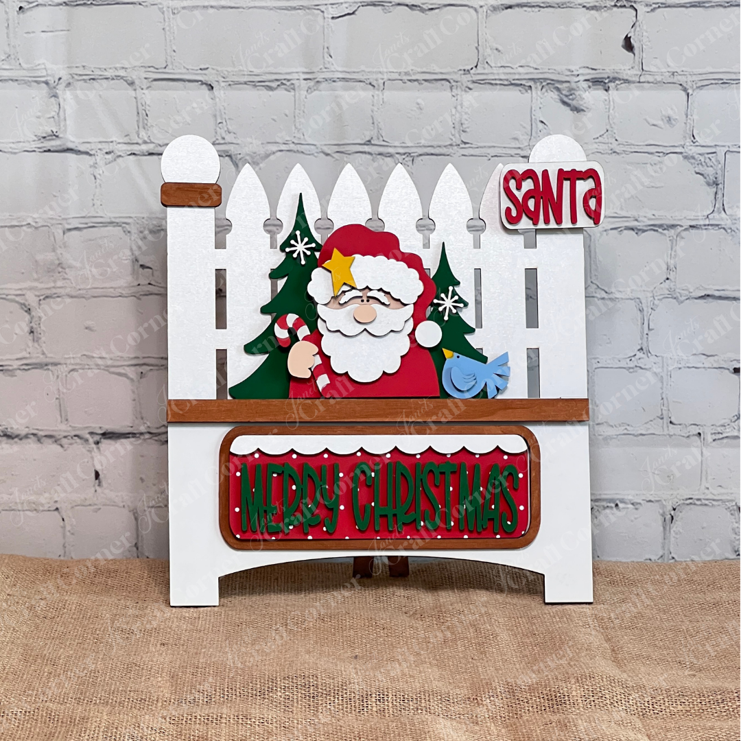 Brighten your holidays with Janet's Craft Corner Santa Merry Christmas Interchangeable Insert, a DIY seasonal home decor kit. This 3-piece set features Santa, a tree, and festive signs—perfect for adding cheer to your space!.
