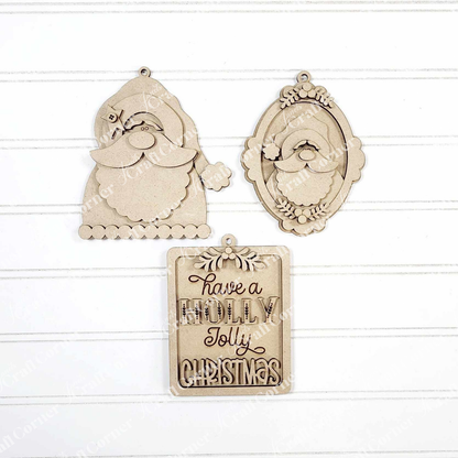 The Santa Ornaments - DIY holiday craft kit - Set of 1 by Janet's Craft Corner includes three unfinished wood Santa ornaments and a "Have a Holly Jolly Christmas" sign—ideal festive decorations for DIY crafting.