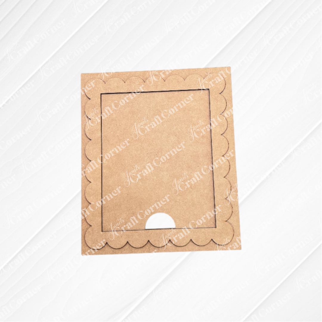 The Single Scallop Trim Farmhouse Frame by Janet's Craft Corner is a brown cardstock photo frame with scalloped edges, a rectangular opening, and a bottom notch—perfect for DIY crafts, shown on a white textured background.