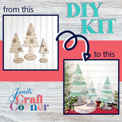 The image highlights a DIY transformation with the "Standing Trees - Set of 3" craft kit. On the left, you see plain wooden tree cutouts with bases. On the right, they've been turned into personalized home décor with green painted surfaces and snowflake ornaments, beautifully arranged on a festive tabletop. Text reads: "from this to this," and "Janet's Craft Corner.