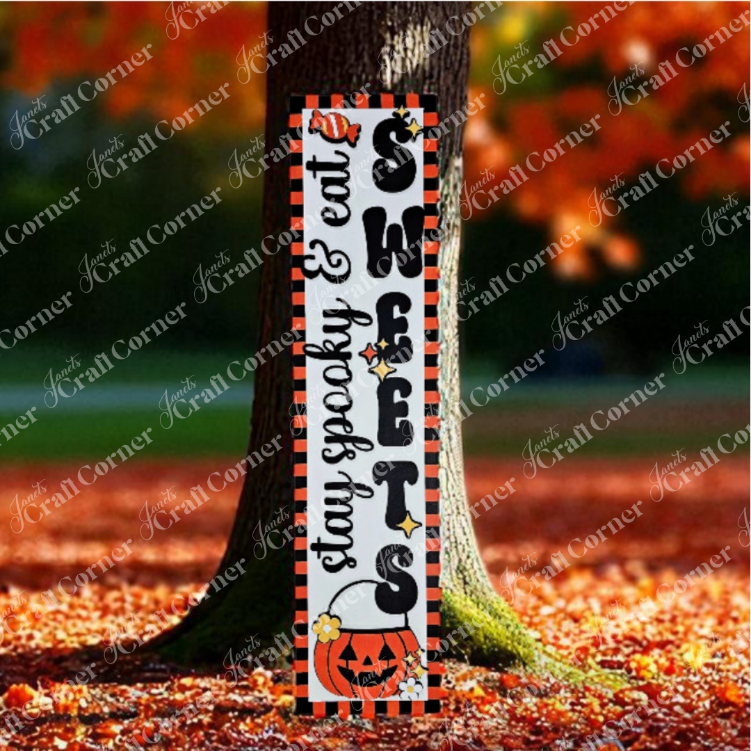 Janet's Craft Corner Stay Spooky Eat Sweets Porch Leaner is a DIY home decor kit featuring a rectangular sign with "SWEETS" and "stay spooky & eat" plus Halloween designs—pumpkin, spider, stars, and candy corn—for your seasonal display.