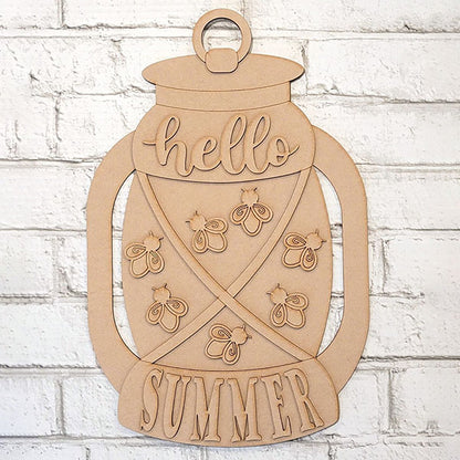 The Summer Lantern Sign by Janet's Craft Corner is a DIY craft kit featuring a wooden jar-shaped lantern design with "hello SUMMER" and fireflies. It's perfect for creating charming farmhouse-style door hangers on brick walls.