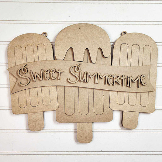 The Sweet Summertime Door Hanger from Janet's Craft Corner is a DIY home decor kit featuring wooden wall art of three ice cream bars. The middle bar has drips, a "Sweet Summertime" banner in decorative script, and a grooved background for added charm.