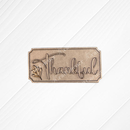The Thankful Mini Shelf Sitter by Janet's Craft Corner is a DIY seasonal home decor kit featuring "Thankful" engraved in cursive with a leaf design—perfect for your Thankful Decor Set or creating unique personalized decorations.