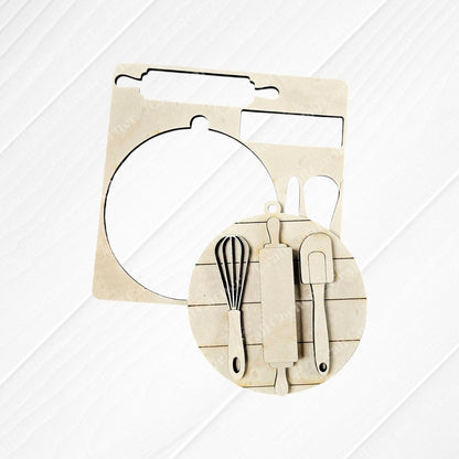 The "Baking Spirits Bright Ornaments - Set of 4" DIY Decoration Kits by Janet's Craft Corner feature hand-painted wooden cutouts of kitchen utensils, like a whisk, rolling pin, and spatula, arranged on a circular base. This delightful set adds a festive touch to your kitchen decor during the holidays.