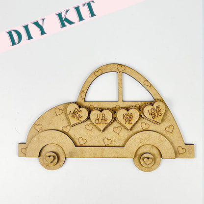 The Valentine Volkswagen Shelf Sitter by Janet's Craft Corner showcases heart-shaped cutouts with messages such as "Be Mine" and "Love Bug," making it an ideal project for handmade crafts enthusiasts who will appreciate the small engraved hearts that bring a charming touch to this delightful DIY kit.