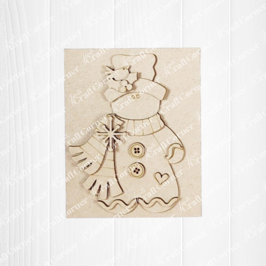 Decorative wooden cutout of a snowman with a scarf on a white background