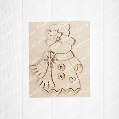 Decorative wooden cutout of a snowman with a scarf on a white background