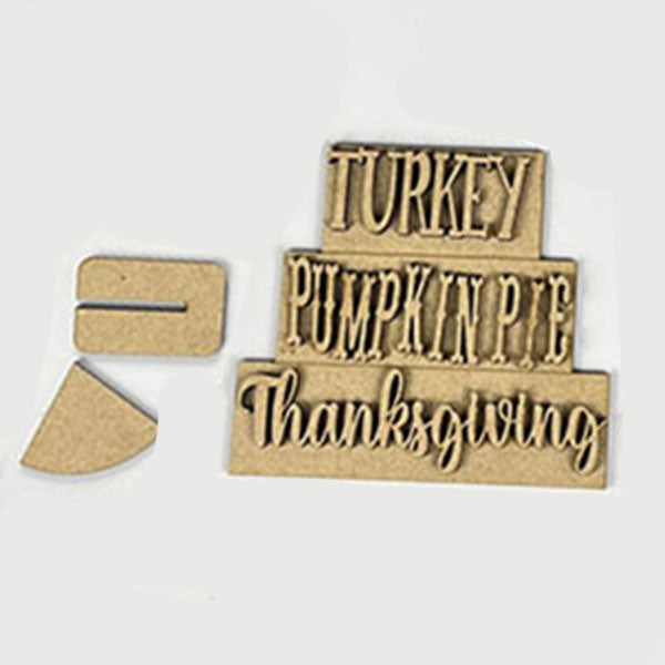 The Give Thanks/Thanksgiving Tiered Tray Kit by Janet's Craft Corner includes a stacked wooden sign featuring the words "Turkey," "Pumpkin Pie," and "Thanksgiving" arranged in three tiers, ideal for decorating your tiered tray. The kit also contains two separate wooden pieces to add delightful accents to your home décor.