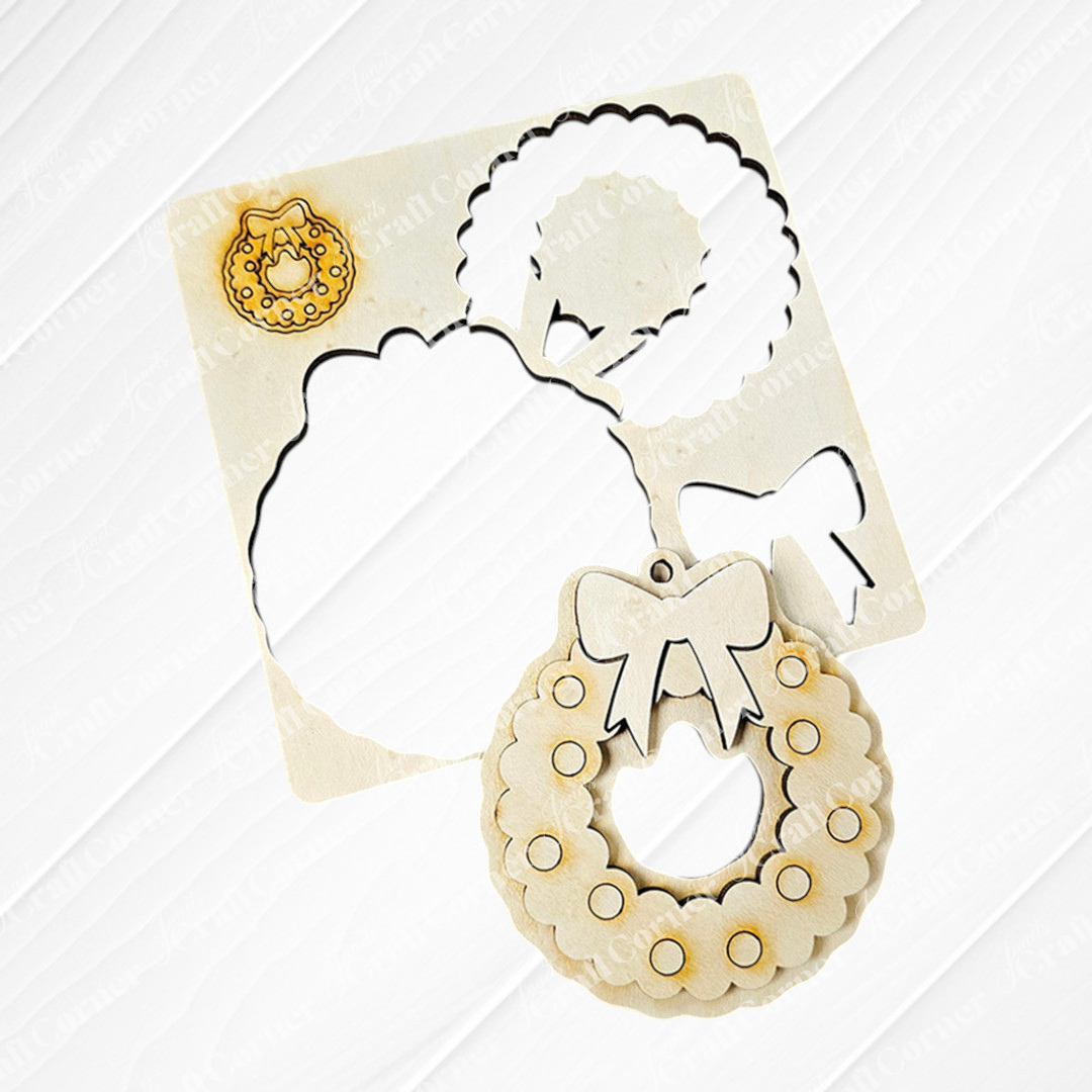 The Sugar Cookie Ornaments - Set of 3 by Janet's Craft Corner offers a charming DIY decoration kit that includes three wooden Christmas ornaments, each shaped like a wreath. They are beautifully adorned with green glitter, red circles, and white dots. A red bow adorns the top of each ornament, tied with a plaid ribbon. These personalized home décor pieces elegantly rest on a wooden surface with greenery in the background.