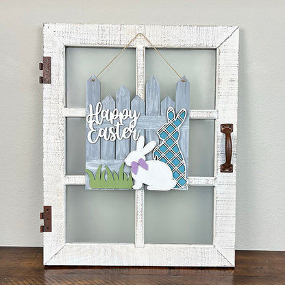 This delightful Easter Picket Fence Door Hanger from Janet's Craft Corner is a charming addition to your home décor. It features a decorative white wooden window frame with a rustic handle, showcasing bunnies and a fence. One bunny wears a purple bow, and the other displays a blue plaid pattern, with "Happy Easter" elegantly displayed on the sign.