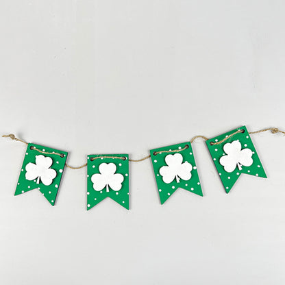 Enhance your home décor with a charming decorative banner from the Lucky St Patricks Tiered Tray Kit by Janet's Craft Corner. This banner showcases four green pennants, each embellished with a white shamrock and a polka dot border, perfect for festive decorating and bringing the festive spirit to any plain background.