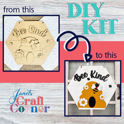 This DIY kit from Janet's Craft Corner allows you to create a captivating "Bee Kind" door hanger. Transform an unpainted wooden hexagonal plaque into a vibrant piece adorned with black lettering, a yellow and orange beehive, and a black and yellow bee, perfectly complementing any rustic farmhouse decor with its craft-themed design.