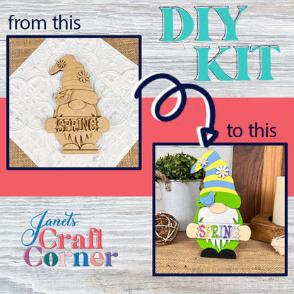 The "Spring Sign Gnome" DIY kit from Janet's Craft Corner includes a wooden cutout featuring "SPRING" on its beard. Once completed, the gnome displays a blue and green hat embellished with daisies, making it a delightful addition to any home décor against a decorative background.